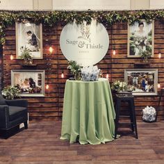 a couple of chairs sitting in front of a table with a green cloth on it