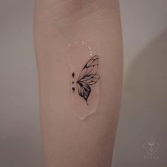 a small butterfly tattoo on the right thigh