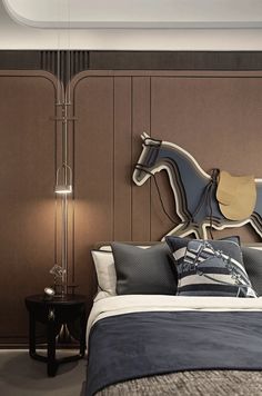 a bedroom with a horse head on the wall above the bed, and two night stands