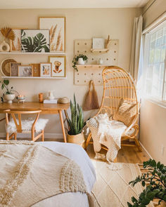 a bedroom with a wicker chair and wooden table