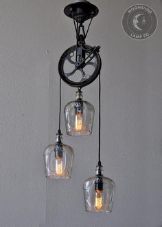 three light fixtures hanging from the ceiling