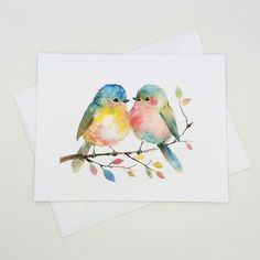 two watercolor birds sitting on a branch with leaves in their beaks and one bird is looking at the other