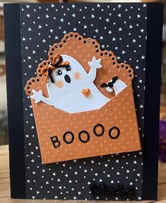 a handmade halloween card with a ghost on it