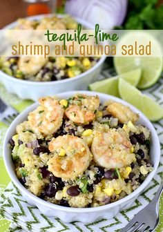 two bowls filled with shrimp and quinoa salad