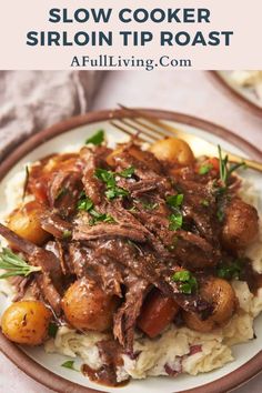 slow cooker sirloin tip roast on top of mashed potatoes