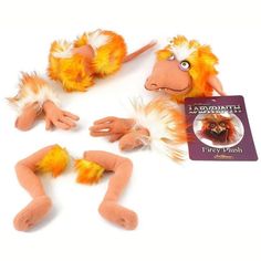 three stuffed animals are laying on the floor with their hands and feet spread out to show them