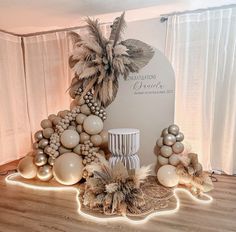 a table topped with balloons and palm trees in front of a sign that says congratulations