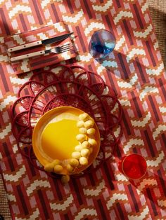 a plate with some food on top of it next to glasses and utensils