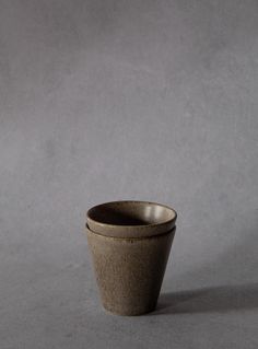 a small cup sitting on top of a table