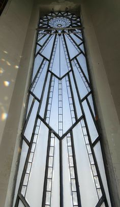 the inside of a building with a very tall window