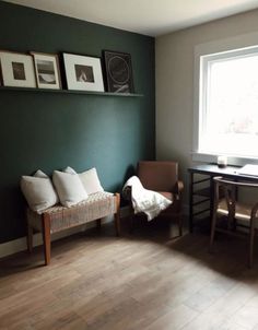 a living room filled with furniture next to a table and chair on top of a hard wood floor