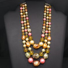 *Description: This is a beautiful Japan necklace which has a variety of multicolored round glass beads with accent art beads which have been hand painted so no two are alike. The necklace also has small bugle beads as spacers, from the 1950s. Japan necklaces have very unique and artistic bead accents. Each one is a beautiful piece of art and no two are alike. This would be a great addition to your vintage jewelry collection or make a great vintage gift! *Approximate Measurements: Length - 17 Inc Vintage Czech Glass Colorful Beads Jewelry, Vintage Czech Glass Bead Jewelry, Vintage Multi-strand Colorful Beaded Necklaces, Vintage Multi-strand Beaded Necklaces With Colorful Beads, Vintage Multi-strand Beaded Necklace With Colorful Beads, Vintage Multicolor Beaded Necklaces, Vintage Multicolor Necklaces With Colorful Beads, Vintage Jewelry With Large Round Beads, Large Vintage Beads For Jewelry Making