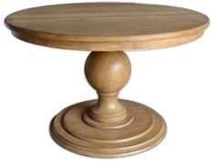 a round wooden table sitting on top of a white floor