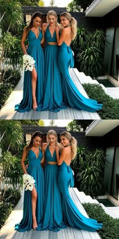 three women in blue dresses posing for the camera