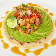 a tortilla topped with avocado and salsa