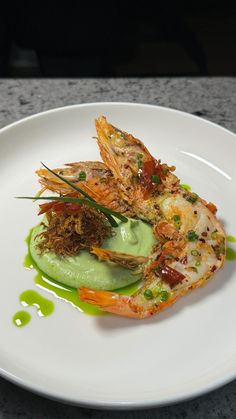 a white plate topped with food on top of a counter