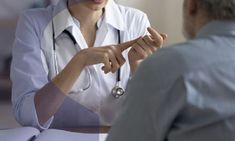 a doctor talking to an elderly woman