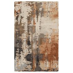 an area rug with various colors and shapes on it, including brown, beige, gray and white