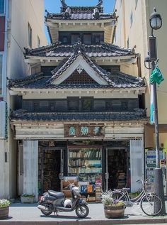 a motorcycle parked in front of a book store