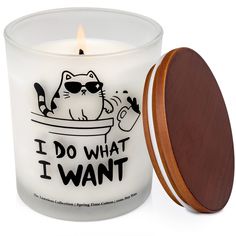 a white candle with a wooden lid and an i do what i want sticker on it