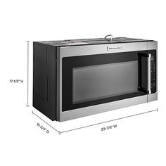 a microwave oven with the door open and measurements