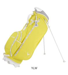 a yellow golf bag sitting on top of a white floor