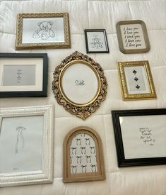 there are many framed pictures on the wall