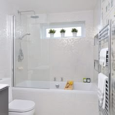 an image of a bathroom with white fixtures