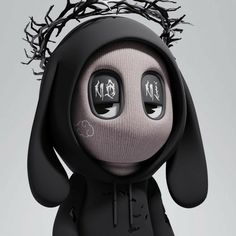 a black and white stuffed animal with some writing on it's eyes, wearing a crown of barbed wire