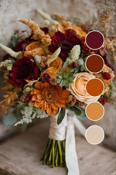 a bridal bouquet with orange and red flowers