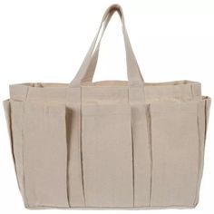 a large canvas bag with three zippers