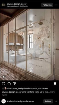 a bathroom with glass walls and marble flooring is pictured in this image from the inside