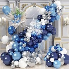 blue and white balloons are arranged in the shape of a letter