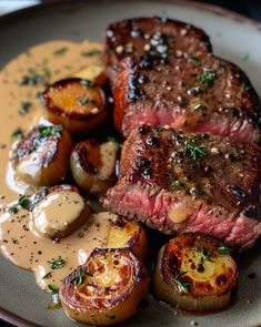 steak, potatoes and gravy on a plate