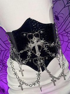 Elevate your style with this edgy Y2K-inspired corset belt, featuring a captivating punk aesthetic. Adorned with intricate cross charms and a bold heart design, this statement piece effortlessly combines rebellious flair with a touch of romance. The belt is enhanced with eye-catching chains that add an extra layer of attitude. Crafted for comfort and versatility, the back of the corset belt is equipped with a convenient Velcro closure. The elastic material provides just the right amount of stret Heart Corset, Edgy Y2k, Cross Applique, Punk Aesthetic, Punk Accessories, Y2k Punk, Kawaii Accessories, Corset Belt, Cross Chain