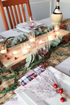 the table is set with candles and plates