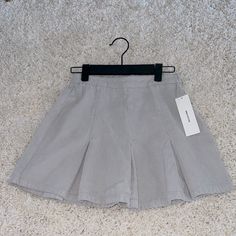 Grey/Gris Corduroy Skirt Urban Outfitters (Never Worn) Trendy Cotton Skirt For School, Cotton Pleated Skort For School Uniform, High-waisted Bottoms For School In Spring, Trendy Cotton Skort For School, Cotton Pleated School Uniform Mini Skirt, Cotton Pleated Mini Skirt For School Uniform, Preppy Cotton Skirt, Preppy Cotton Short Tennis Skirt, Preppy Cotton Mini Tennis Skirt