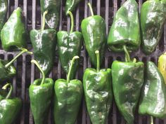 green peppers are cooking on the grill