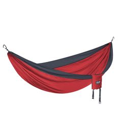 a red and black hammock hanging from the side