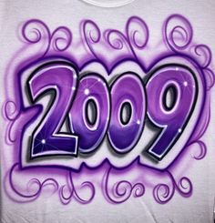 a white shirt with purple graffiti writing on it's chest and the word 2009 written in large letters