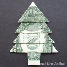 an origami christmas tree made out of one dollar bill on a black background