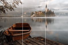 a wooden boat sitting on top of a lake