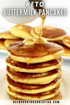 a stack of pancakes with syrup being poured on top and the words keto buttermilk pancakes above it