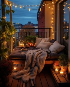 a balcony with lights and pillows on it