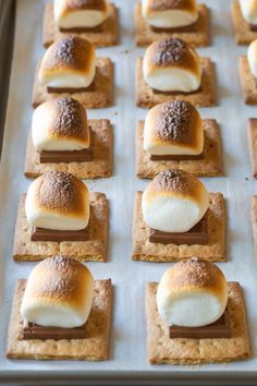 there are many desserts on the tray ready to be baked in the oven for consumption