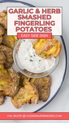 garlic and herb smashed fingerling potatoes on a white plate with ranch dip in the middle