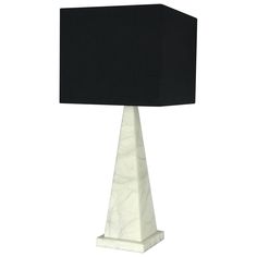 a white marble table lamp with a black shade on the base and a square light fixture