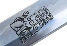 a knife with an image of two cats on it