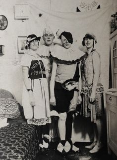 an old black and white photo of three women standing next to each other in a bedroom