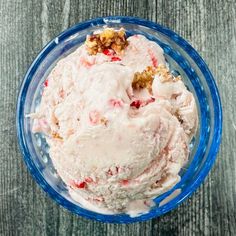 a bowl filled with ice cream on top of a wooden table